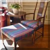 F18. Henredon open arm chair with ottoman in striped fabric. 